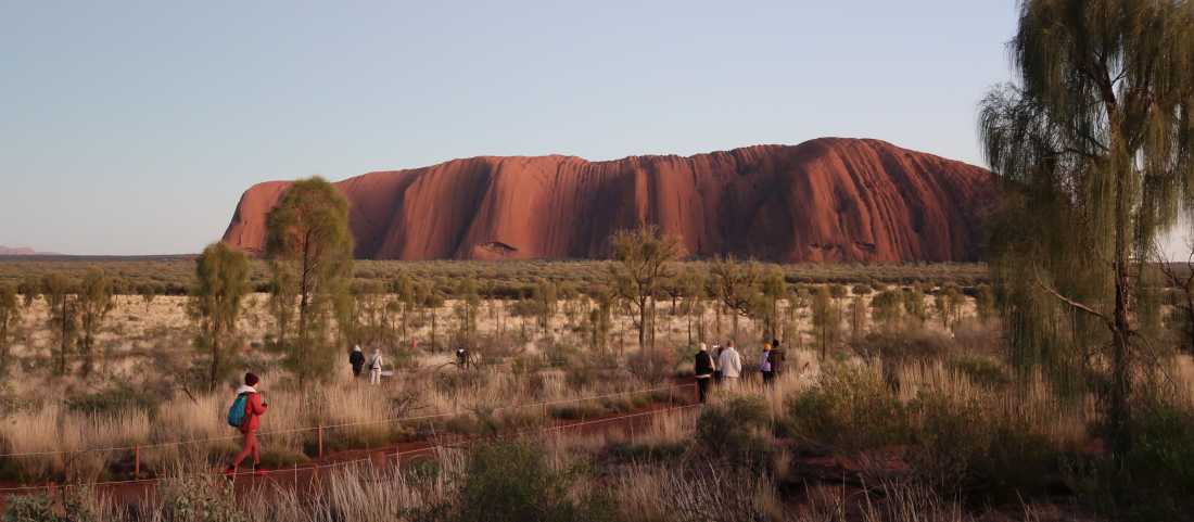 Walking around Uluru at sunrise |  Erin Wileman
